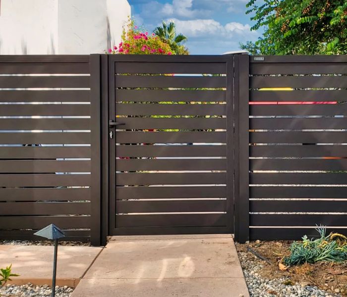 About the Fence Guys -Metal gate with slats