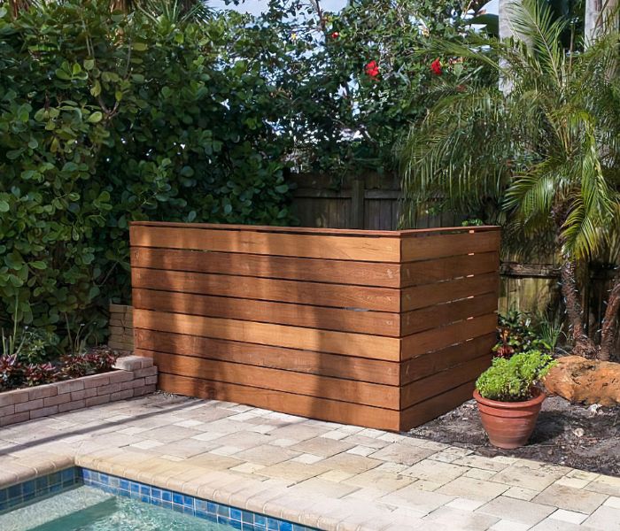 About the Fence Guys - Wooden fence for pool equipment